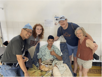 William Harvin, MD, with a patient and other volunteers. 